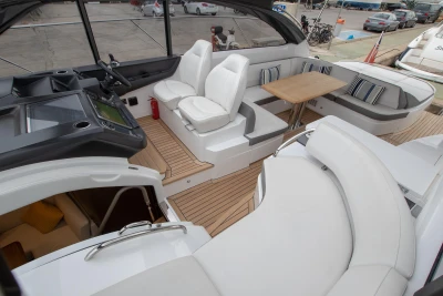 2017 Princess V48 Open yacht interior with luxurious seating and wooden flooring.