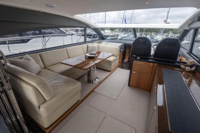 Luxurious interior of 2012 Princess V52 yacht with elegant seating and modern design.