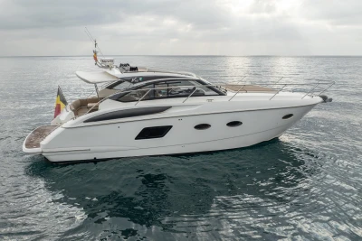 2014 Princess V39 yacht on calm sea under cloudy sky.