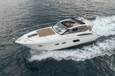 2014 Princess V39 yacht cruising on open water, side view.