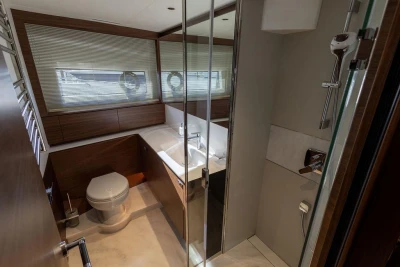 Luxurious bathroom interior of 2026 Princess X80 yacht with modern fixtures and wooden accents.