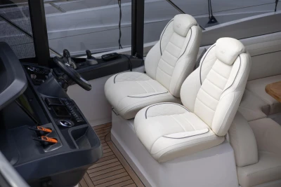Luxurious interior of 2023 Princess V50 Open yacht with plush white seating.