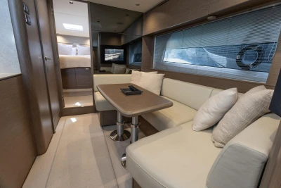 Luxurious interior of 2023 Princess V50 Open yacht with elegant seating and modern design.