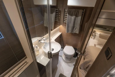 Luxurious bathroom in 2023 Princess V50 Open yacht, featuring modern fixtures and elegant design.