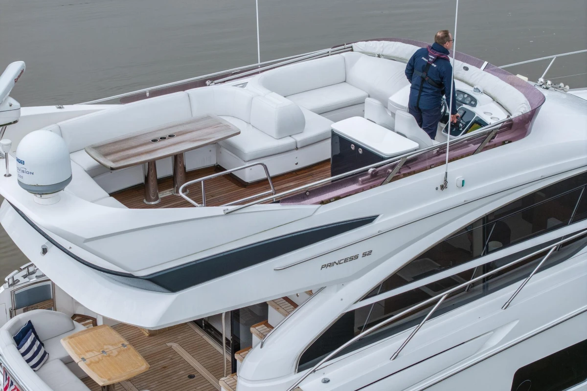 Luxurious 2017 Princess 52 yacht with spacious upper deck and modern helm.