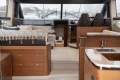 Luxurious interior of a 2017 Princess 52 yacht with elegant wood finishes and modern amenities.