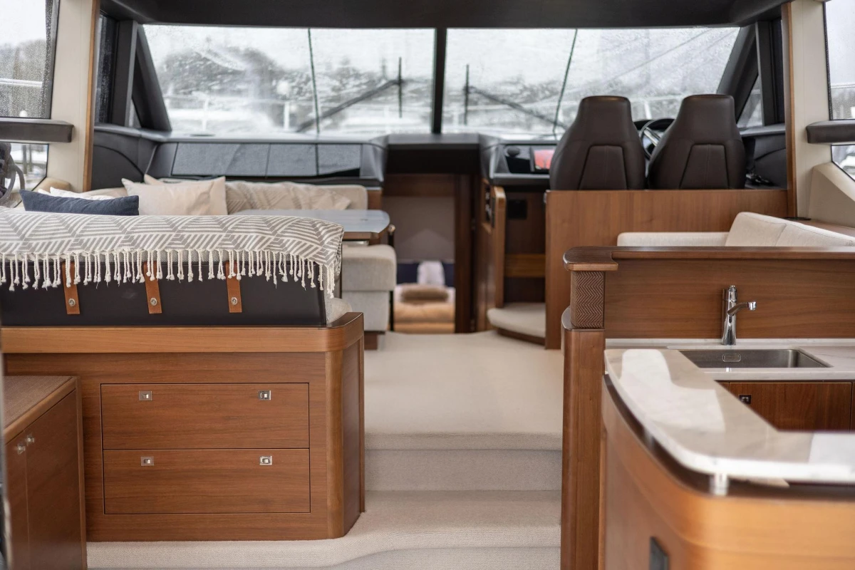 Luxurious interior of a 2017 Princess 52 yacht with elegant wood finishes and modern amenities.