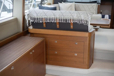 Luxurious interior of 2017 Princess 52 yacht with elegant wood cabinetry and seating.