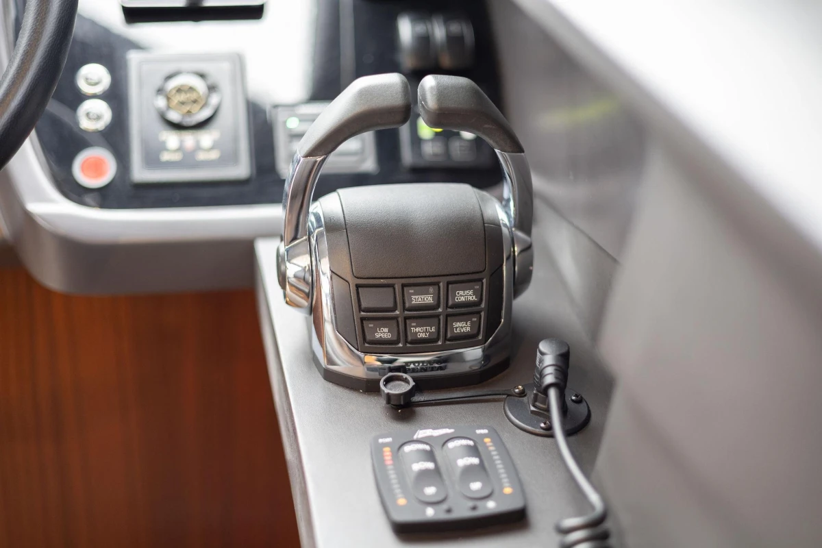 Control panel of a 2017 Princess 52 yacht, featuring throttle and cruise control.