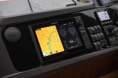 Control panel of a 2017 Princess 52 yacht with navigation and monitoring displays.