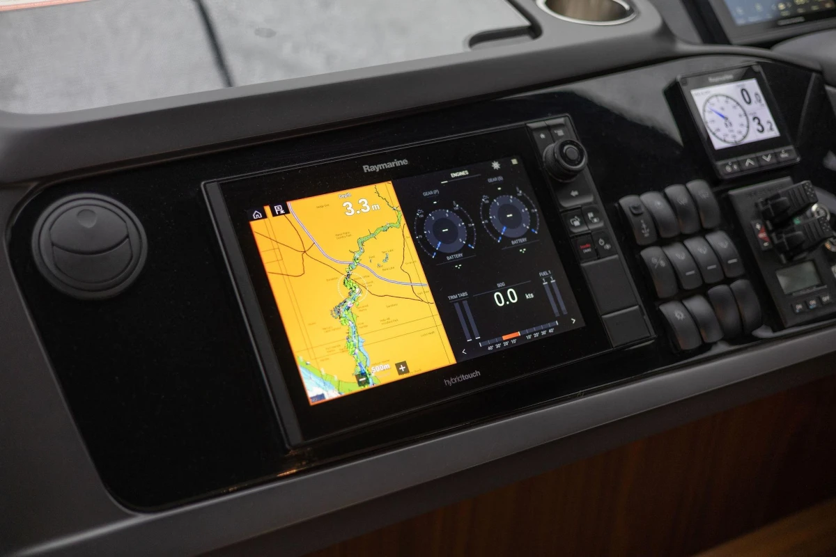 Control panel of a 2017 Princess 52 yacht with navigation and monitoring displays.