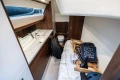 Luxurious interior of 2017 Princess 52 yacht with modern bathroom and storage area.
