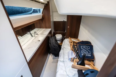 Luxurious interior of 2017 Princess 52 yacht with modern bathroom and storage area.