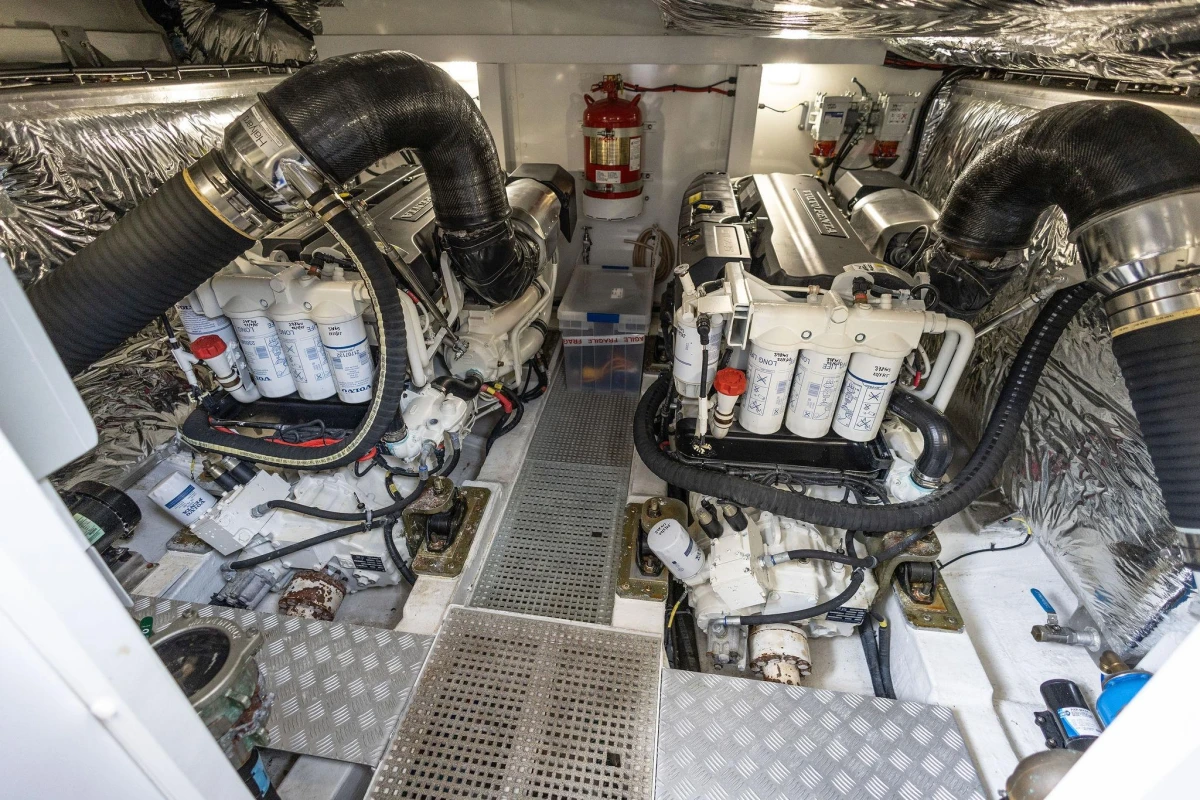 Engine room of a 2017 Princess 52 yacht, featuring dual engines and metallic insulation.