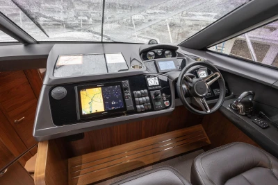 Cockpit of 2017 Princess 52 yacht with modern navigation controls and leather seating.