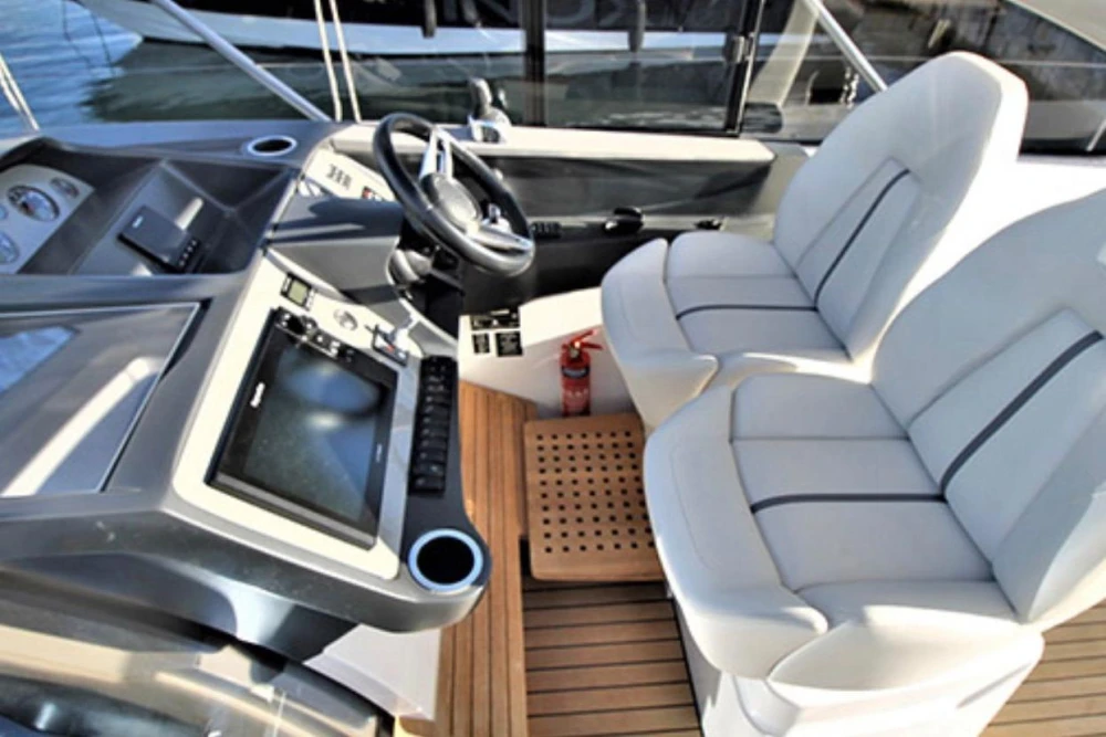 Helm of 2017 Princess V40 yacht with dual seats and modern controls.