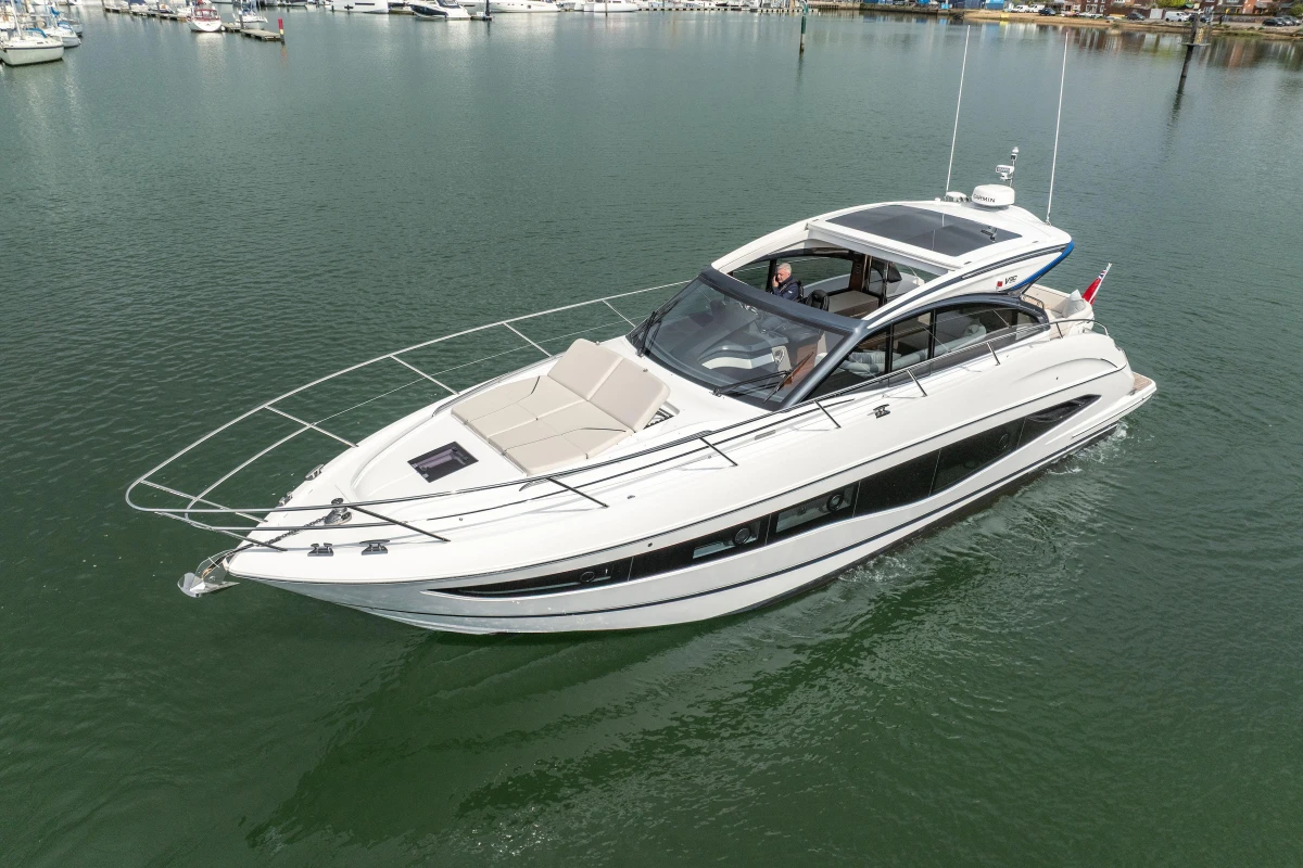 2025 Princess V50 yacht cruising on calm waters, showcasing sleek design and luxury features.