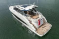 2025 Princess V50 yacht cruising on open water, showcasing sleek design and luxury features.