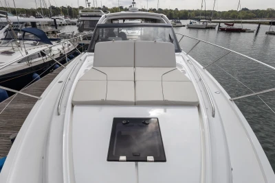 2025 Princess V50 yacht with sleek design, docked in a marina.
