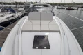 2025 Princess V50 yacht with sleek design, docked in a marina.