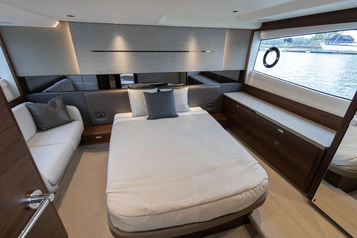 Luxurious interior of 2025 Princess V50 yacht with elegant bedroom design.