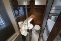 Luxurious bathroom interior of 2025 Princess V50 yacht, featuring modern fixtures and elegant wood finishes.