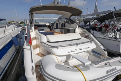 2015 Princess V39 yacht docked, featuring spacious seating and elegant design.