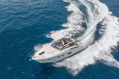 Aerial view of 2015 Princess V39 yacht cruising on open blue sea.