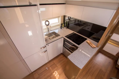 Modern kitchen in 2016 Princess V58 Open yacht with sleek countertops and appliances.