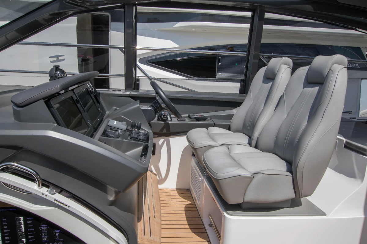 2016 Princess V58 Open yacht cockpit with modern controls and plush seating.