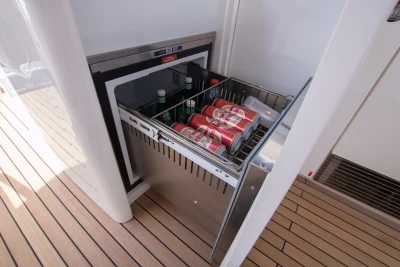 Open fridge on 2016 Princess V58 Open yacht with drinks inside.