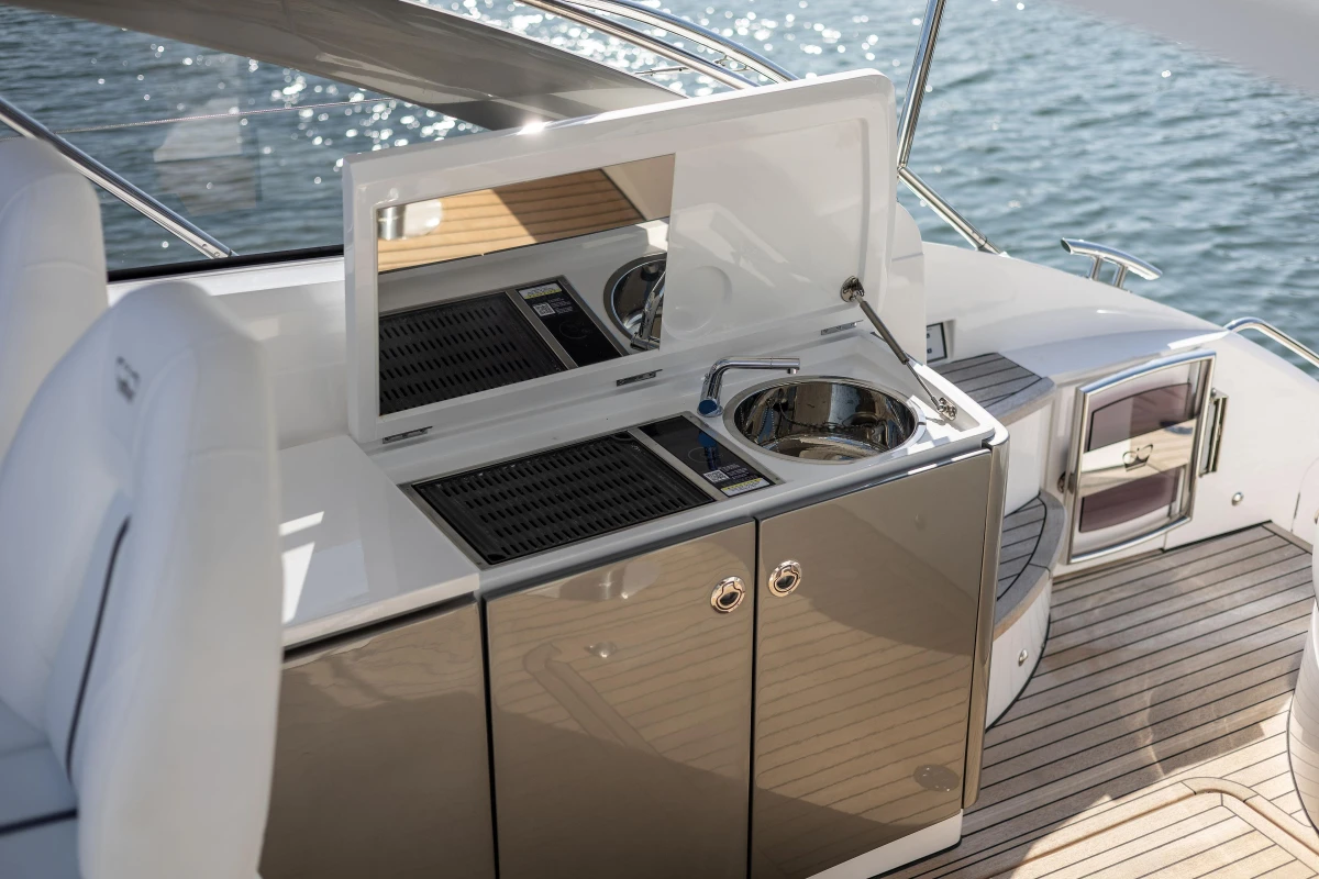 2024 Princess V40 yacht kitchenette with sink and grill on deck.