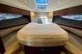 Luxurious 2024 Princess V40 yacht cabin with elegant bedding and modern design.