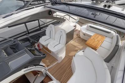 Luxurious 2024 Princess V40 yacht interior with sleek seating and modern helm.