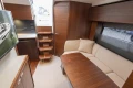 Luxurious interior of 2024 Princess V40 yacht with elegant wood finishes and cozy seating area.