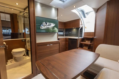 Luxurious interior of 2024 Princess V40 yacht with modern wood finishes and elegant design.