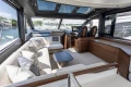 Luxurious interior of 2025 Princess S65 yacht with plush seating and modern design.