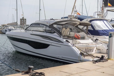2018 Princess V40 yacht docked at marina, sleek design, luxury vessel.