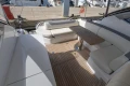 2018 Princess V40 yacht interior with elegant seating and wooden table.