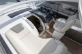 Luxurious interior of 2018 Princess V40 yacht with plush seating and modern dashboard.