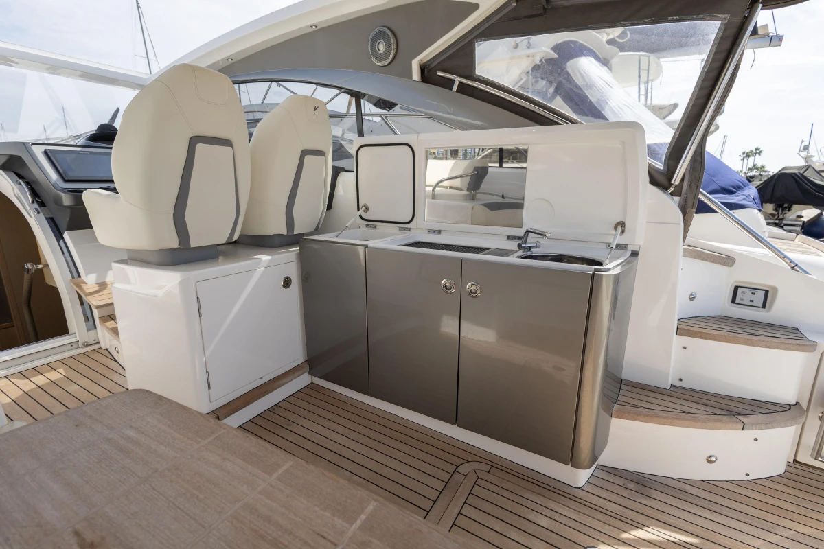 Luxury yacht interior with modern kitchenette and seating, Princess V40, 2018 model.
