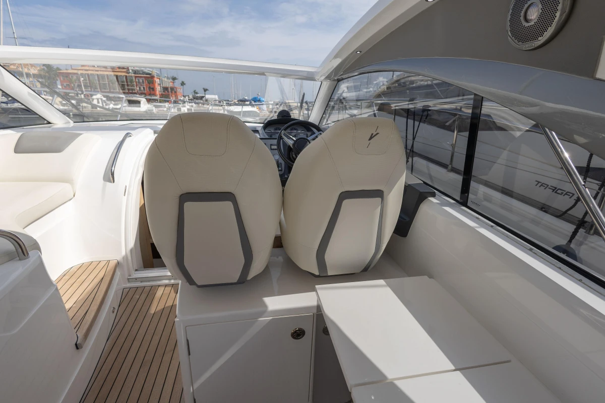 Interior of 2018 Princess V40 yacht with modern seating and dashboard view.