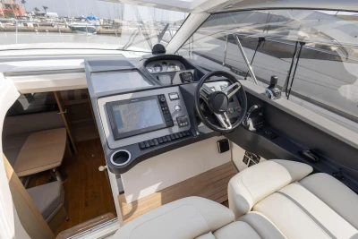 2018 Princess V40 yacht cockpit with modern navigation controls and luxurious seating.