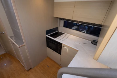 Modern kitchen interior of 2018 Princess V40 yacht with sleek cabinetry and appliances.