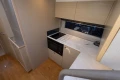 Modern kitchen interior of 2018 Princess V40 yacht with sleek cabinetry and appliances.
