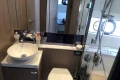 Modern bathroom in 2022 Princess V40 yacht with sink, toilet, and shower.