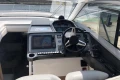 Helm of 2022 Princess V40 yacht with modern navigation equipment and steering wheel.