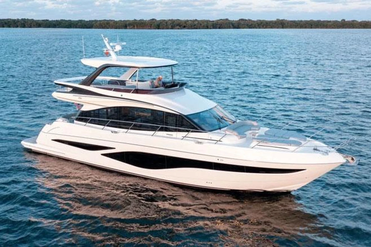 2025 Princess F65 yacht cruising on open water, showcasing sleek design and luxury features.
