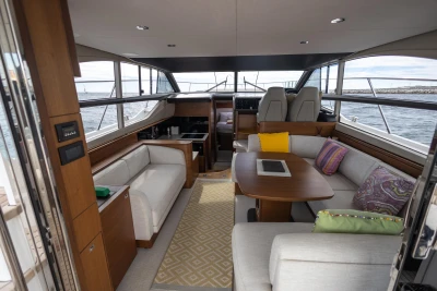Luxurious interior of a 2018 Princess 43 yacht with elegant seating and ocean views.