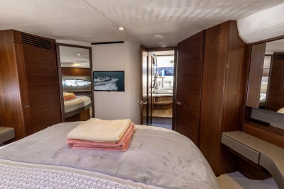 Luxurious cabin interior of 2018 Princess 43 yacht with elegant wood finishes.